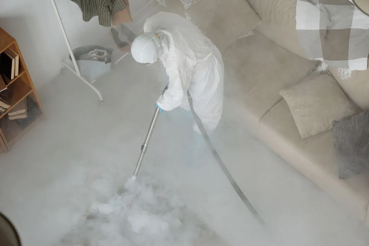 Biohazard cleanup technician in protective equipment, Lebanon, OH